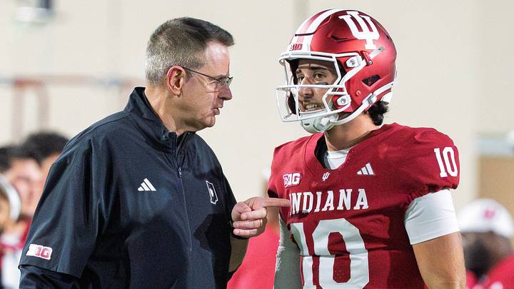 Indiana Head Coach Curt Cignetti talks with Josh Hoover (10) during the Indiana versus Northwestern football game at Memorial Stadium on Friday, Sept. 25, 2026.