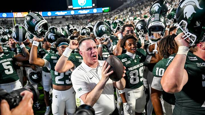 Michigan State’s head coach Pat Fitzgerald, center, sings the fight song with the team after defeating Toledo on Friday, Sept. 4, 2026, at Spartan Stadium in East Lansing. Michigan State’s head coach Pat Fitzgerald, center, sings the fight song with the team after defeating Toledo on Friday, Sept. 4, 2026, at Spartan Stadium in East Lansing.