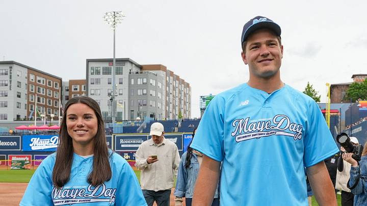 Ann Michael and Drake Maye walk across the field at Polar Park before the inaugural MayeDay Celebrity Softball Classic. Ann Michael and Drake Maye walk across the field at Polar Park before the inaugural MayeDay Celebrity Softball Classic.
