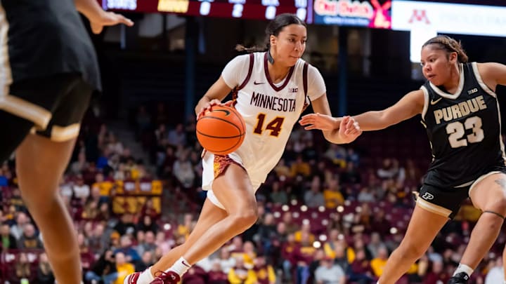 Gophers wing Tori McKinney drives against Purdue. 