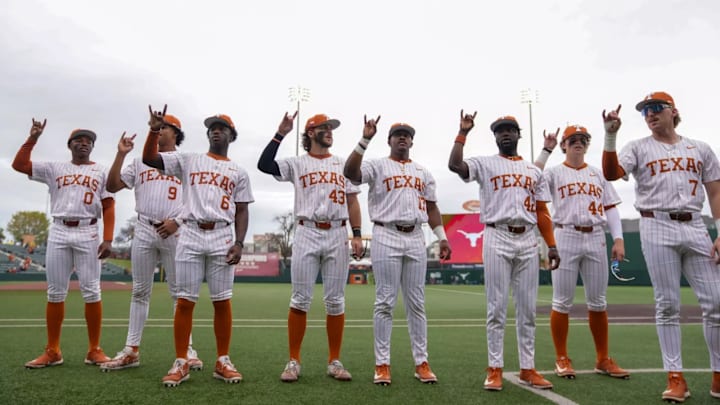 The Texas Longhorns baseball team sings the school song prior to the series opener against the Ole Miss Rebels.