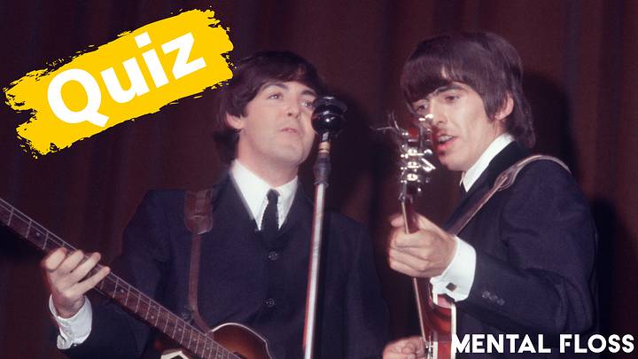 Paul McCartney and George Harrison playing guitars Paul McCartney and George Harrison playing guitars