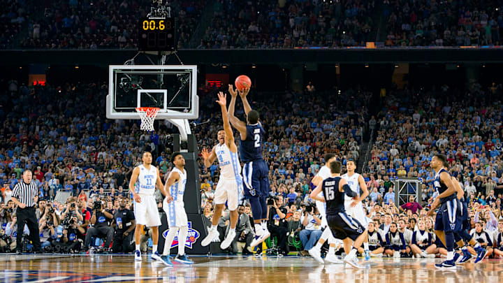 Villanova’s Kris Jenkins shoots the game-winning shot over North Carolina’s Isaiah Hicks to give the Wildcats the 2016 national championship.