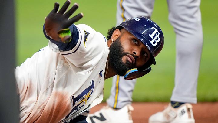 Rays third baseman Junior Caminero sparked a 12th-inning rally by reaching base on a throwing error.
