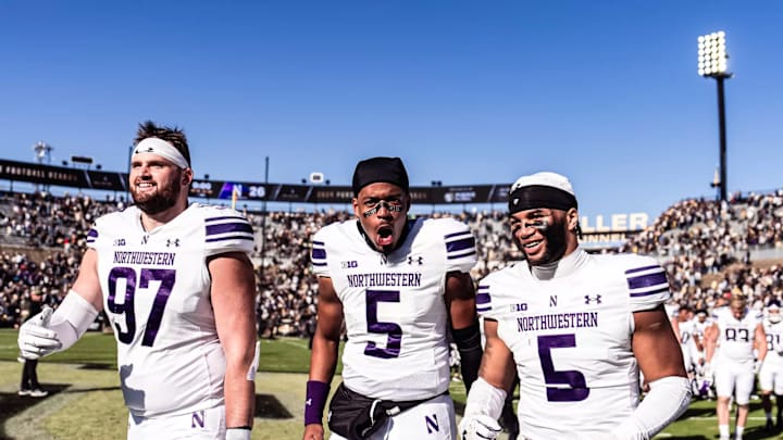 Kenny Soares Jr. walks off the field at Purdue with teammates.
