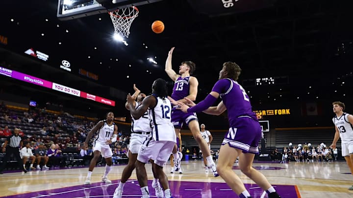 Northwestern's Brooks Barnhizer releases a shot against Butler in 2024.