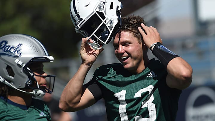 Nevada quarterback Chubba Purdy (13) laughs with his teammates during practice at Mackay Stadium in Reno on July 25, 2024.