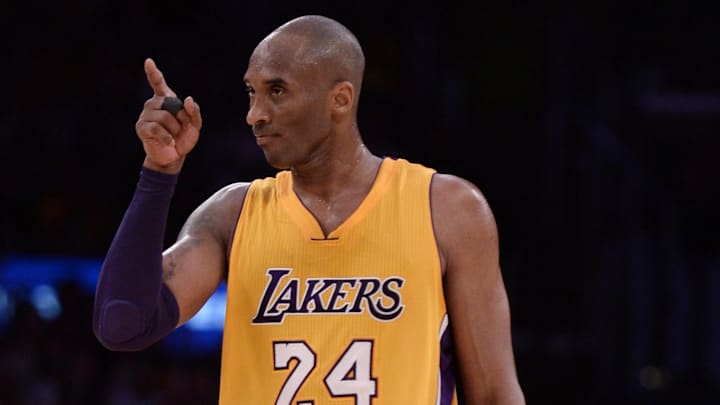 Apr 13, 2016; Los Angeles Lakers forward Kobe Bryant points to a teammate during the third quarter against the Utah Jazz at Staples Center.