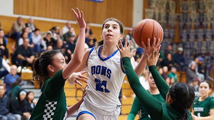 Acalanes fourth-year starter and leading scorer Dulci Vail swoops in for a basket at recent game