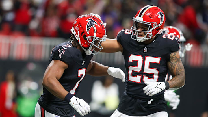 Nov 26, 2023; Atlanta, Georgia, USA; Atlanta Falcons running back Bijan Robinson (7) celebrates after a touchdown with running back Tyler Allgeier (25) against the New Orleans Saints in the second quarter at Mercedes-Benz Stadium. Mandatory Credit: Brett Davis-Imagn Images
