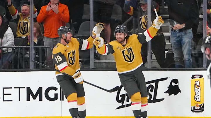 Mar 30, 2026; Las Vegas, Nevada, USA; Vegas Golden Knights defenseman Rasmus Andersson (4) celebrates with right wing Reilly Smith (19) after scoring a goal against the Vancouver Canucks during the second period at T-Mobile Arena. Mandatory Credit: Stephen R. Sylvanie-Imagn Images Mar 30, 2026; Las Vegas, Nevada, USA; Vegas Golden Knights defenseman Rasmus Andersson (4) celebrates with right wing Reilly Smith (19) after scoring a goal against the Vancouver Canucks during the second period at T-Mobile Arena. Mandatory Credit: Stephen R. Sylvanie-Imagn Images