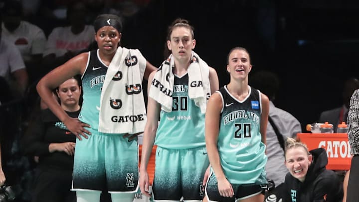 Aug 6, 2023; Brooklyn, New York, USA; New York Liberty forwards Jonquel Jones (35) and Breanna Stewart (30) and guard Sabrina Ionescu (20) watch the game from the bench in the fourth quarter against the Las Vegas Aces at Barclays Center. Mandatory Credit: Wendell Cruz-Imagn Images