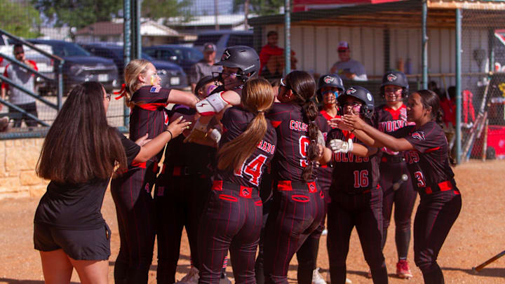 Colorado City softball's Bryanna Munoz (1) celebrates at home plate with the rest of the team after a home run against Eldorado at Eldorado High School.