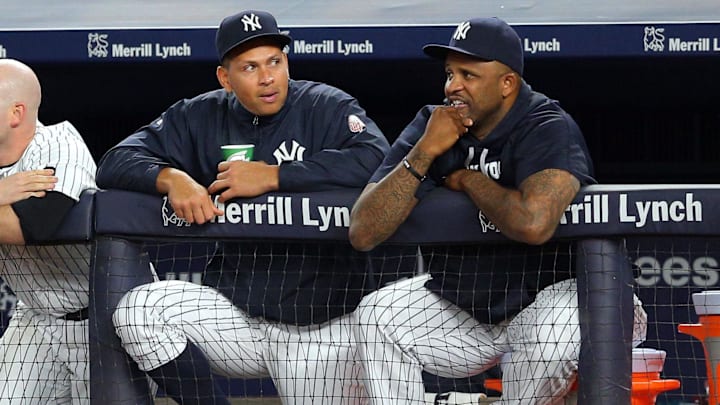 Aug 4, 2016; Bronx, NY, USA; New York Yankees pinch hitter Alex Rodriguez (13) talks with New York Yankees starting pitcher CC Sabathia (52) in the dugout during the ninth inning against the New York Mets at Yankee Stadium. Mandatory Credit: Brad Penner-Imagn Images