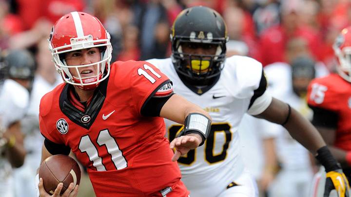 Nov 9, 2013; Athens, GA, USA; Georgia Bulldogs quarterback Aaron Murray (11) runs through the Appalachian State Mountaineers defense during the second half at Sanford Stadium. Georgia defeated Appalachian State 45-6. Mandatory Credit: Dale Zanine-Imagn Images