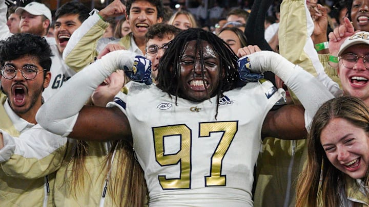 Nov 18, 2023; Atlanta, Georgia, USA; Georgia Tech Yellow Jackets defensive lineman Eddie Kelly (97) celebrates with fans after a victory against the Syracuse Orange at Bobby Dodd Stadium at Hyundai Field. Mandatory Credit: Brett Davis-Imagn Images
Nov 18, 2023; Atlanta, Georgia, USA; Georgia Tech Yellow Jackets defensive lineman Eddie Kelly (97) celebrates with fans after a victory against the Syracuse Orange at Bobby Dodd Stadium at Hyundai Field. Mandatory Credit: Brett Davis-Imagn Images