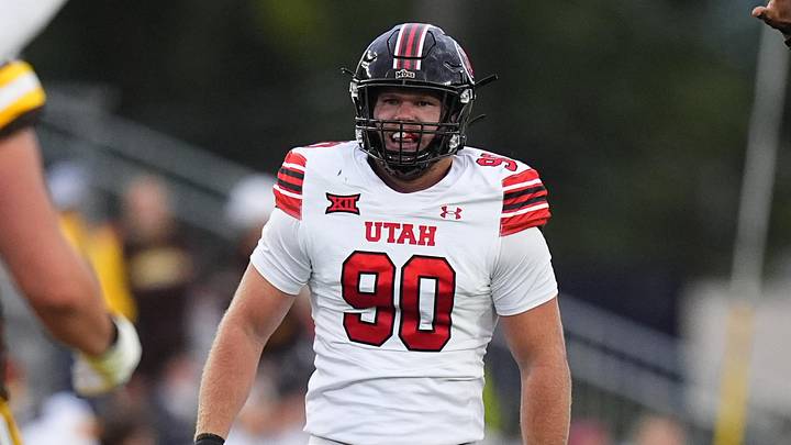 Sep 13, 2025; Laramie, Wyoming, USA; Utah Utes defensive end John Henry Daley (90) celebrates his sack in the first quarter against the Wyoming Cowboys at Jonah Field at War Memorial Stadium. Mandatory Credit: Ron Chenoy-Imagn Images