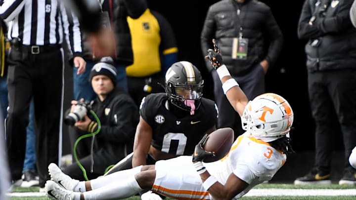 Nov 30, 2024; Nashville, Tennessee, USA; Tennessee Volunteers defensive back Jermod McCoy (3) intercepts the pass thrown to Vanderbilt Commodores wide receiver Junior Sherrill (0) during the first half at FirstBank Stadium. Mandatory Credit: Steve Roberts-Imagn Images Nov 30, 2024; Nashville, Tennessee, USA; Tennessee Volunteers defensive back Jermod McCoy (3) intercepts the pass thrown to Vanderbilt Commodores wide receiver Junior Sherrill (0) during the first half at FirstBank Stadium. Mandatory Credit: Steve Roberts-Imagn Images