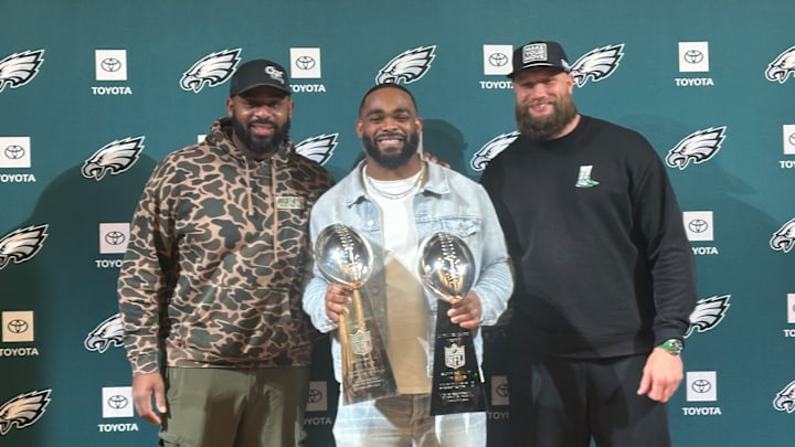 Lane Johnson and Fletcher Cox with Brandon Graham at Graham's retirement press conference on March 18, 2025.