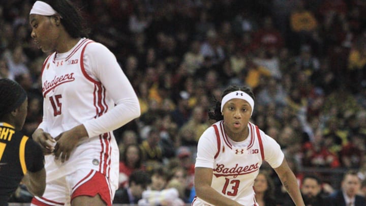 Wisconsin point guard Ronnie Porter (13) uses as screen from Gift Uchenna on a drive to the basket against Iowa at the Kohl Center in Madison, Wis. on March 1, 2026 Wisconsin point guard Ronnie Porter (13) uses as screen from Gift Uchenna on a drive to the basket against Iowa at the Kohl Center in Madison, Wis. on March 1, 2026