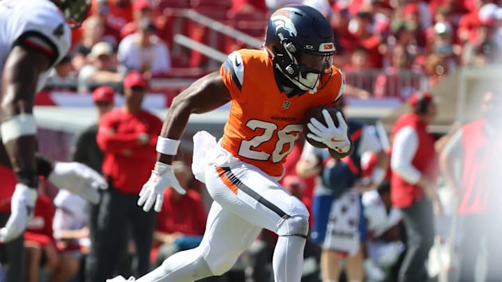 Sep 22, 2024; Tampa, Florida, USA; Denver Broncos running back Tyler Badie (28) runs with the ball against the Tampa Bay Buccaneers during the second half at Raymond James Stadium. 