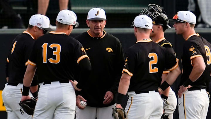 Iowa baseball head coach Rick Heller talks to infielders during a pitching change against Bradley April 16, 2025 at Duane Banks Field in Iowa City, Iowa.