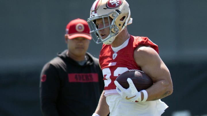 Jun 10, 2025; Santa Clara, CA, USA; San Francisco 49ers running back Christian McCaffrey (23) runs a play from scrimmage during an OTA at Levi's Stadium. Mandatory Credit: D. Ross Cameron-Imagn Images