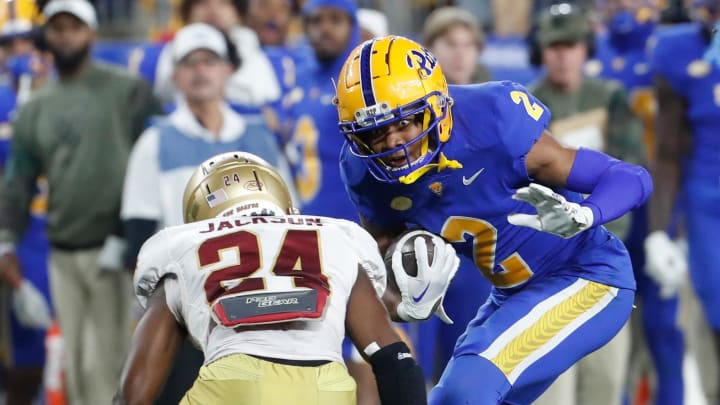 Nov 16, 2023; Pittsburgh, Pennsylvania, USA;  Pittsburgh Panthers wide receiver Kenny Johnson (2) runs after a catch as Boston College Eagles cornerback Amari Jackson (24) defends during the second quarter at Acrisure Stadium. Mandatory Credit: Charles LeClaire-USA TODAY Sports