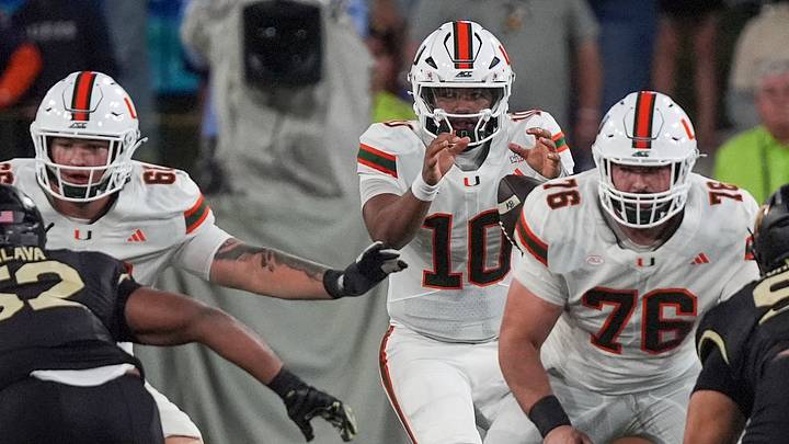 Sep 18, 2026; Winston-Salem, North Carolina, USA;  Miami (FL) Hurricanes quarterback Darian Mensah (10) takes the snap from Miami (FL) Hurricanes offensive lineman Ryan Rodriguez (76) during the first half at Allegacy Federal Credit Union Stadium.  Mandatory Credit: Jim Dedmon-Imagn Image