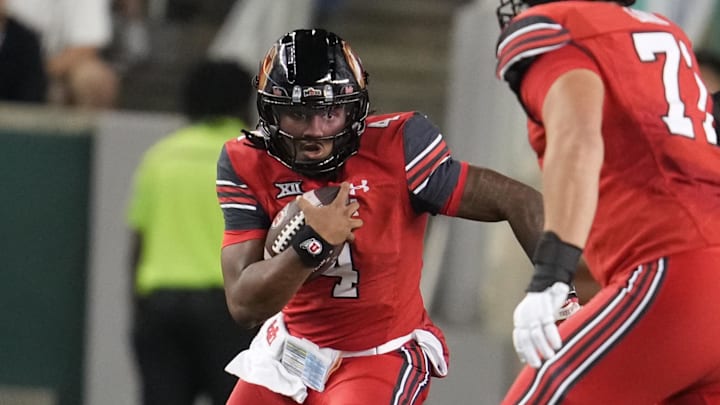 Utah Utes quarterback Devon Dampier (4) carries the ball against the Baylor Bears during the first half at McLane Stadium.