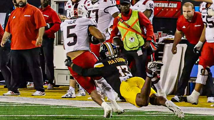 Southern Mississippi Golden Eagles linebacker Mathis Haygood (13) brings down Arkansas State Red Wolves running back Kenyon Clay (5) in a NCAA Football game between Southern Miss Golden Eagles and Arkansas State Red Wolves at Carlisle-Faulkner Field at Renasant Stadium. October 17, 2026 (Joe Harper/bgnphoto.com)