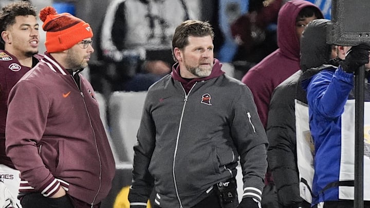 Jan 3, 2025; Charlotte, NC, USA;  Virginia Tech Hokies head coach Brent Fry on the sideline during the second quarter against the Minnesota Golden Gophers at the Duke’s Mayo Bowl at Bank of America Stadium. Mandatory Credit: Jim Dedmon-Imagn Images