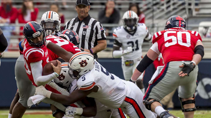 Oct 20, 2018; Oxford, MS, USA; Auburn Tigers defensive linemen Nick Coe (91) and Derrick Brown (5) sack Mississippi Rebels quarterback Jordan Ta'amu (10) during the second half at Vaught-Hemingway Stadium. Mandatory Credit: Vasha Hunt-Imagn Images