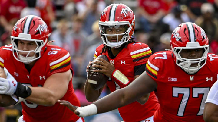 Oct 11, 2025; College Park, Maryland, USA;  Maryland Terrapins quarterback Malik Washington (7) looks to throw from the pocket as offensive lineman Michael Hershey (61) and offensive lineman Amory Hills (77) block during the game against the Nebraska Cornhuskers at SECU Stadium. Mandatory Credit: Tommy Gilligan-Imagn Images