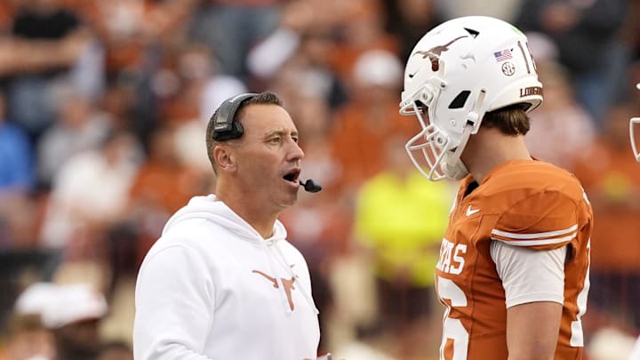 Nov 1, 2025; Austin, Texas, USA; Texas Longhorns head coach Steve Sarkisian talks with quarterback Arch Manning (16) during a timeout in the second half against the Vanderbilt Commodores at Darrell K Royal-Texas Memorial Stadium. Mandatory Credit: Scott Wachter-Imagn Images