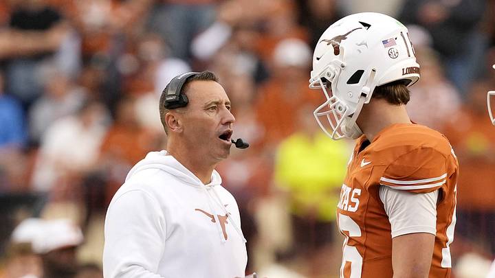 Texas Longhorns head coach Steve Sarkisian talks with quarterback Arch Manning (16) during a timeout in the second half against the Vanderbilt Commodores at Darrell K Royal-Texas Memorial Stadium.