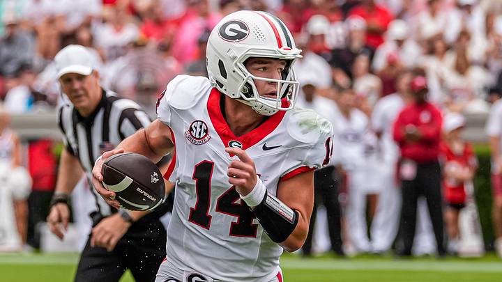 Sep 12, 2026; Athens, Georgia, USA; Georgia Bulldogs quarterback Gunner Stockton (14) rolls out and runs against the Western Kentucky Hilltoppers during the first half at Sanford Stadium. Mandatory Credit: Dale Zanine-Imagn Images