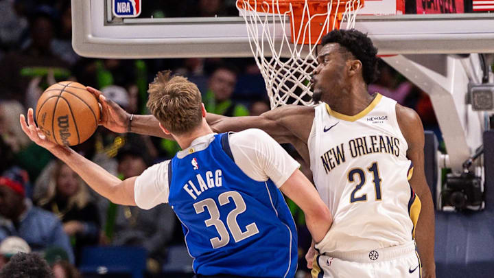 Mar 16, 2026; New Orleans, Louisiana, USA;  New Orleans Pelicans center Yves Missi (21) knocks the ball from Dallas Mavericks forward Cooper Flagg (32) during the second half at Smoothie King Center. Mandatory Credit: Stephen Lew-Imagn Images