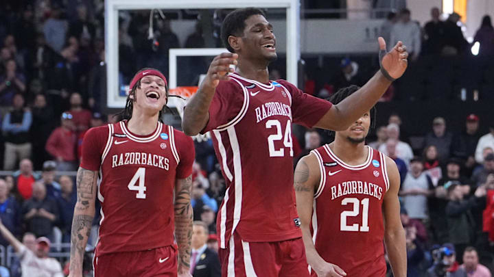 Mar 22, 2025; Providence, RI, USA; Arkansas Razorbacks forward Trevon Brazile (4), forward Billy Richmond III (24) and guard D.J. Wagner (21) celebrate after defeating the St. John's Red Storm in a second round men’s NCAA Tournament game at Amica Mutual Pavilion. Mandatory Credit: Gregory Fisher-Imagn Images