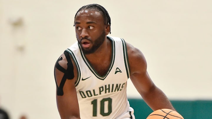 Jacksonville Dolphins guard Gyasi Powell (10) takes the ball down the court during first half