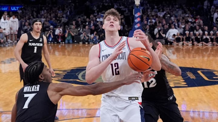 Mar 12, 2026; New York, NY, USA; Xavier Musketeers guard Isaiah Walker (7) stops UConn Huskies center Eric Reibe (12) during the first half at Madison Square Garden. Mandatory Credit: Robert Deutsch-Imagn Images Mar 12, 2026; New York, NY, USA; Xavier Musketeers guard Isaiah Walker (7) stops UConn Huskies center Eric Reibe (12) during the first half at Madison Square Garden. Mandatory Credit: Robert Deutsch-Imagn Images