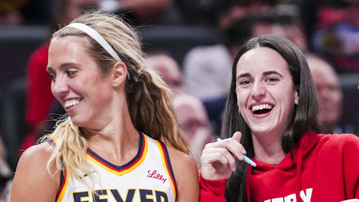 Jun 3, 2025; Indianapolis, Indiana, USA; Indiana Fever guard Lexie Hull (10), guard Caitlin Clark (22), and guard Sophie Cunningham (8) laugh near the team bench during a game between the Indiana Fever and the Washington Mystics at Gainbridge Fieldhouse in Indianapolis. Mandatory Credit:  Grace Smth- INDIANAPOLIS STAR-Imagn Images
