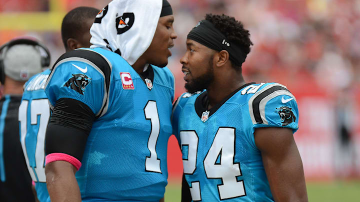 Oct 4, 2015; Tampa, FL, USA; Carolina Panthers defensive back Josh Norman (24) celebrates with Carolina Panthers quarterback Cam Newton (1) after a interception return for touchdown in the first half against the Tampa Bay Buccaneers at Raymond James Stadium. 