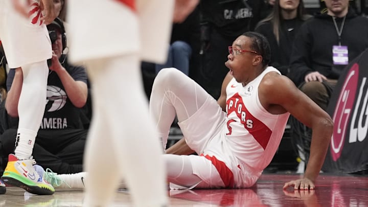 Dec 9, 2024; Toronto, Ontario, CAN; Toronto Raptors forward Scottie Barnes (4) reacts after injuring his leg during the second half against the New York Knicks at Scotiabank Arena. Mandatory Credit: John E. Sokolowski-Imagn Images