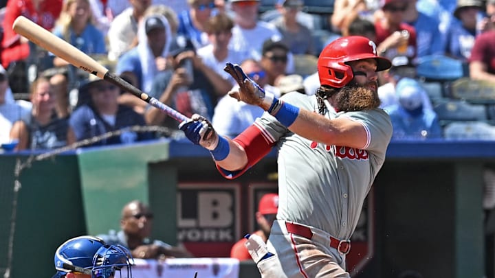 Kansas City, Missouri, USA; Philadelphia Phillies left fielder Brandon Marsh (16) singles in the sixth inning against the Kansas City Royals shortstop Bobby Witt Jr. (7) at Kauffman Stadium. Kansas City, Missouri, USA; Philadelphia Phillies left fielder Brandon Marsh (16) singles in the sixth inning against the Kansas City Royals shortstop Bobby Witt Jr. (7) at Kauffman Stadium.