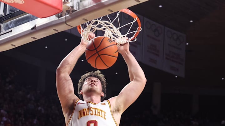 Jan 29, 2026; Ames, Iowa, USA;  Colorado Buffaloes forward Bangot Dak (8) watches Iowa State Cyclones guard Nate Heise (0) score during the first half at James H. Hilton Coliseum. 