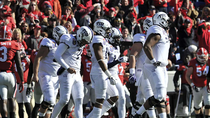 Dec 30, 2016; Memphis, TN, USA; TCU Horned Frogs quarterback Kenny Hill (7) walks off the field during the first half against the Georgia Bulldogs at Liberty Bowl. Mandatory Credit: Justin Ford-Imagn Images