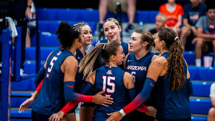 Arizona volleyball team talks during a match.