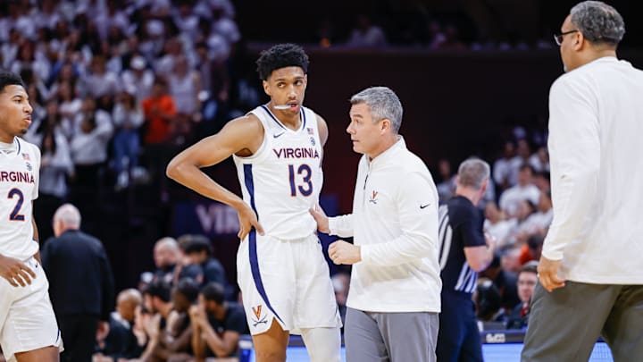 Tony Bennett talks to Ryan Dunn during the Virginia men's basketball game against Miami at John Paul Jones Arena.