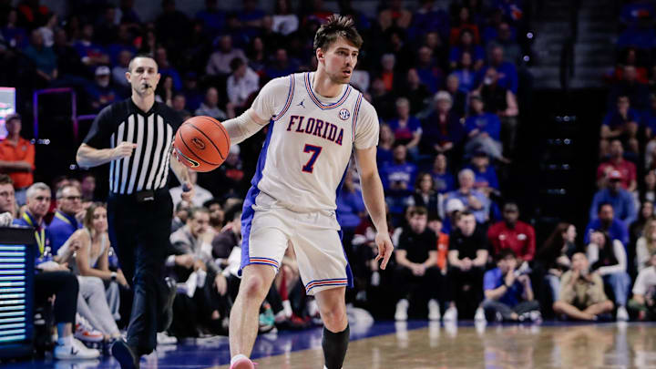 Feb 28, 2026; Gainesville, Florida, USA; Florida Gators guard Urban Klavzar (7) handles the ball against the Arkansas Razorbacks during the second half at Exactech Arena at the Stephen C. O'Connell Center. Mandatory Credit: Travis Register-Imagn Images Feb 28, 2026; Gainesville, Florida, USA; Florida Gators guard Urban Klavzar (7) handles the ball against the Arkansas Razorbacks during the second half at Exactech Arena at the Stephen C. O'Connell Center. Mandatory Credit: Travis Register-Imagn Images